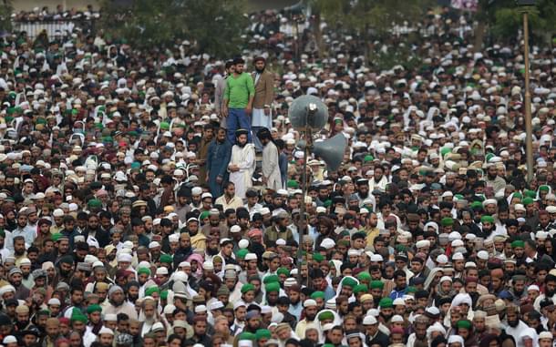 Pakistani supporters of convicted murderer Mumtaz Qadri offers funeral prayers for Qadri a day after his execution in Rawalpindi on March 1, 2016. Tens of thousands of supporters of a Pakistani Islamist executed for gunning down a liberal governor gathered for his funeral March 1, sparking fears of violence, as schools closed and police cordoned off flashpoints. AFP PHOTO / Aamir QURESHI / AFP / AAMIR QURESHI (Photo credit: AAMIR QURESHI/AFP/Getty Images)